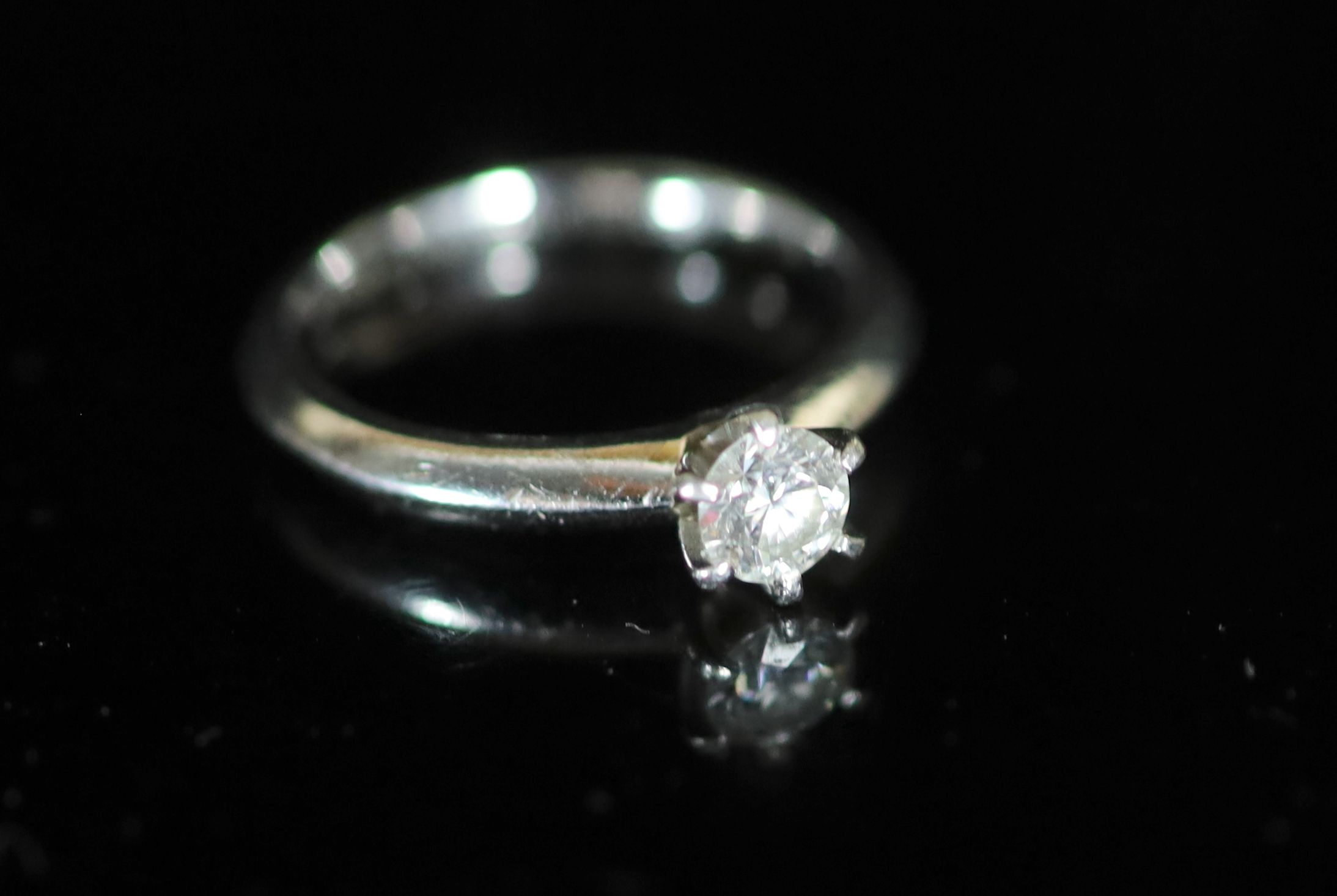 A modern Tiffany & Co platinum and round brilliant cut solitaire diamond ring